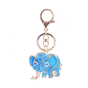 Golden elephant keychain with blue rhinestones featuring a key ring and lobster clasp