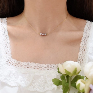 Minimalist 14K gold filled necklace featuring three natural purple freshwater pearls