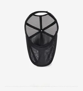 Detail of the inner structure of a black mesh baseball cap with adjustable velcro strap