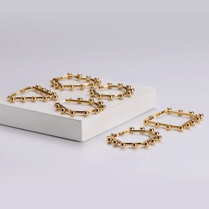 Golden geometric earrings with beads in circle triangle and square shapes for women