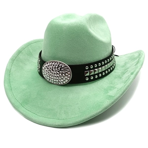 Detail of mint green suede cowboy hat with studded leather band and crystal accents