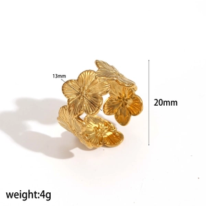 Gold stainless steel hollow flower ring featuring 3D floral design on a white background