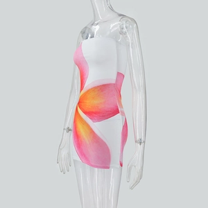 Side view of white tube mini dress featuring vibrant pink and orange floral prints
