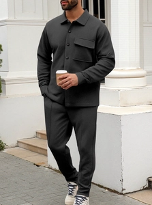 Detail of men's casual two-piece dark grey set featuring vertical rib texture and chest pocket