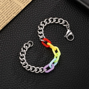 S-shaped rainbow acrylic and stainless steel link chain bracelet on black leather background