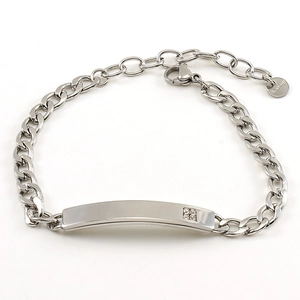 Detail view of silver Cuban link bracelet with engraved ID plate and CZ stones