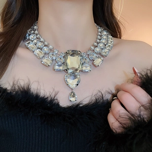 Macro shot of tiered rhinestone necklace with rectangle, heart and teardrop crystals