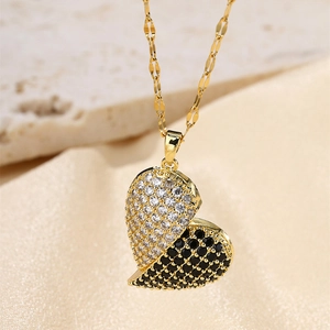 Macro shot of double heart pendant necklace with black and white pavé cubic zirconia