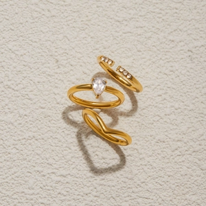 Three-piece gold plated stainless steel ring set with teardrop zircon and V-shape band
