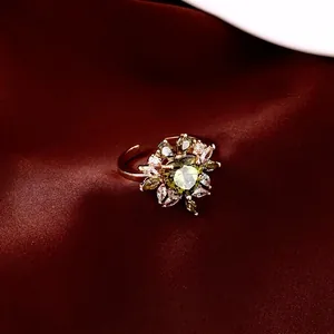 14k gold plated adjustable ring featuring heart-shaped green stone and zircon flowers