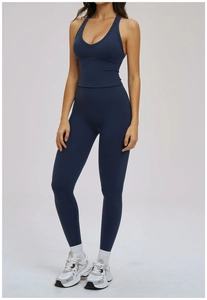 Detail of dark blue yoga set with V-neck sports bra and high waisted leggings