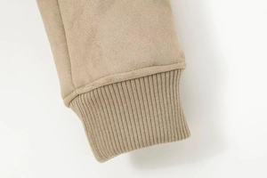 Detail of the high-quality beige suede fabric and ribbed knit cuffs on this casual jacket