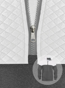 Detail of diamond-quilted texture and metal zipper on white and grey pullover