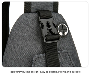 Detail of durable black buckle and headphone jack on gray canvas crossbody bag