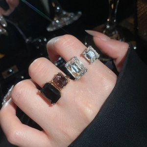 Macro shot of luxury geometric rings with large crystals in silver finish