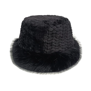 Detailed close-up of a black plush bucket hat showing the fluffy faux fur texture