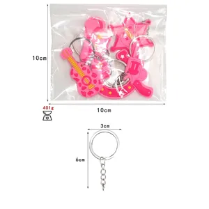 Pink PVC cowboy girl keychain set with guitar and star charms with size dimensions