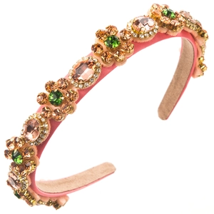 Detail view of pink satin headband with hand-sewn floral crystal and rhinestone patterns
