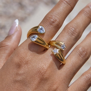 Detailed view of 18k gold plated stainless steel open rings with star and heart zircons