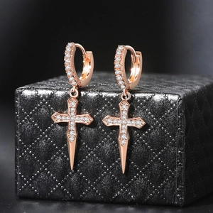 Sparkling zircon cross hoop earrings in rose gold finish on elegant jewelry box