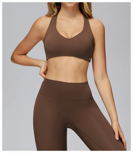 Detail of high-waist dark brown yoga set featuring smooth matte fabric and fine stitching