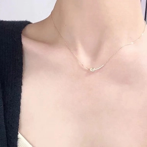 Elegant gold S925 sterling silver necklace featuring a sparkling bow pendant for women