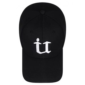 Black cotton baseball cap with white letter u embroidery on a clean white background