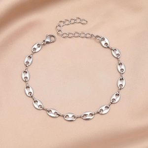 Elegant stainless steel pig nose chain bracelet with adjustable clasp on silk fabric