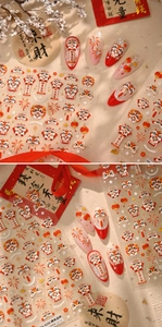 Close-up of Chinese New Year nail stickers featuring lion dance and lantern motifs