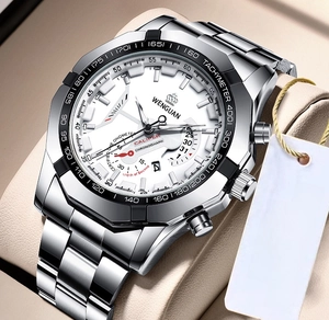 Close-up of a silver stainless steel men's watch with white dial and red chronograph hands