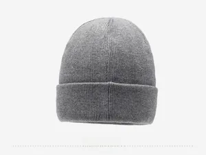 Detail view of grey winter knit beanie with thick ribbed texture and rolled edge