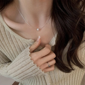 Elegant minimalist freshwater pearl pendant necklace on a silver chain for women