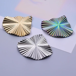 Irregular textured shell pendants in gold, silver and iridescent stainless steel finishes