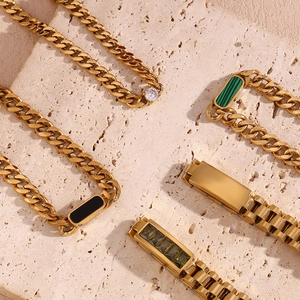 Detailed macro view of 18K gold plated Cuban chains with colorful zircon and stones