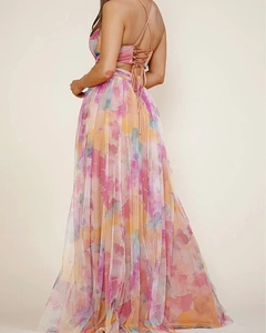 Detail of backless mesh dress with lace-up straps and colorful watercolor floral print