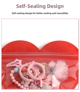 Detail of red heart-shaped resealable bag with secure zip-lock for hair accessories