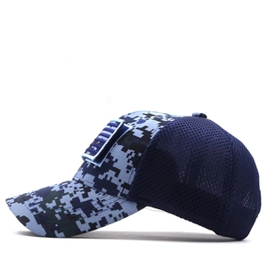 Detail of digital camo baseball cap featuring breathable mesh and tactical flag patch