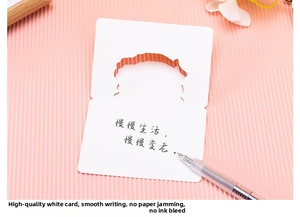 Detail of creative greeting card with hollow edge and handwritten Chinese typography