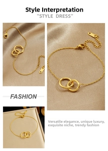Detailed view of gold intertwined double ring bracelet on elegant champagne satin fabric