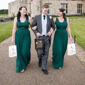European wedding gift bags with Team Groom and Team Bride gold foil prints in castle scene
