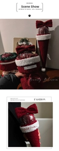 Detail of Christmas apple gift bag in red plush fabric with white faux fur trim and bow