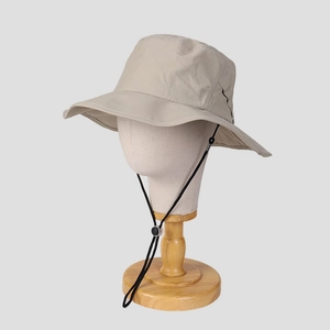 Detail of a nylon quick-dry sun hat with a wide brim and adjustable chin cord on a mannequin
