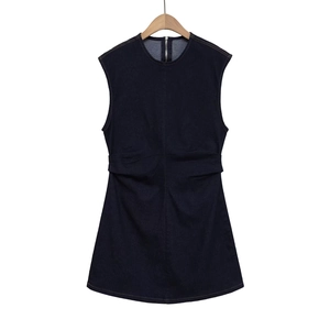 Detailed close-up of dark blue sleeveless denim dress with back zipper and ruched waistline