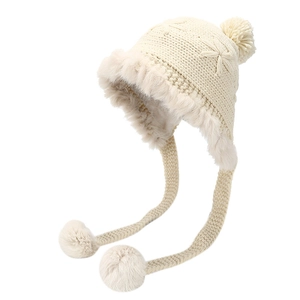 Women's cream knit trapper hat with pom-poms and cozy faux fur trim for winter warmth