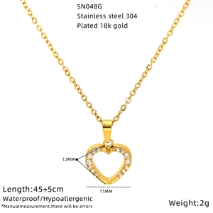 Detail of 18K gold plated heart pendant with zircon on stainless steel chain