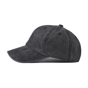 Side view of charcoal grey washed baseball cap with embroidered coconut tree pattern