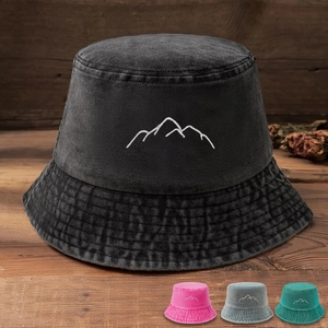 Detail of charcoal gray washed denim bucket hat with white mountain line embroidery