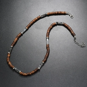 Close-up of ethnic men's necklace with coconut shell, wood beads and natural stones