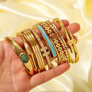 Elegant gold-plated stainless steel bangles with H-letter and emerald zircon inlays
