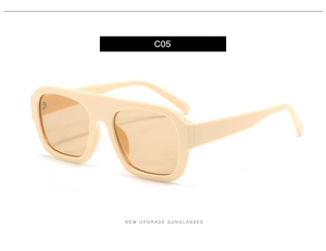 Detail view of cream oversized square sunglasses with thick frames and amber lenses